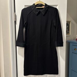 Elegant Black Dress with Embellished Collar